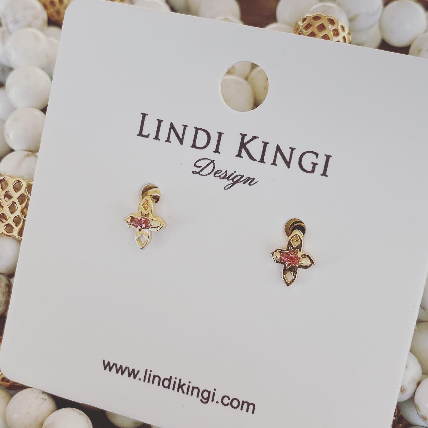 A Dusting of Jewels - Rhodolite Tiny Cross Studs | Gold